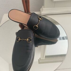 Gucci Black Mules with Gold Accents